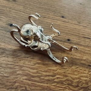 Gold Octopus phone stand, or photo easel, small.